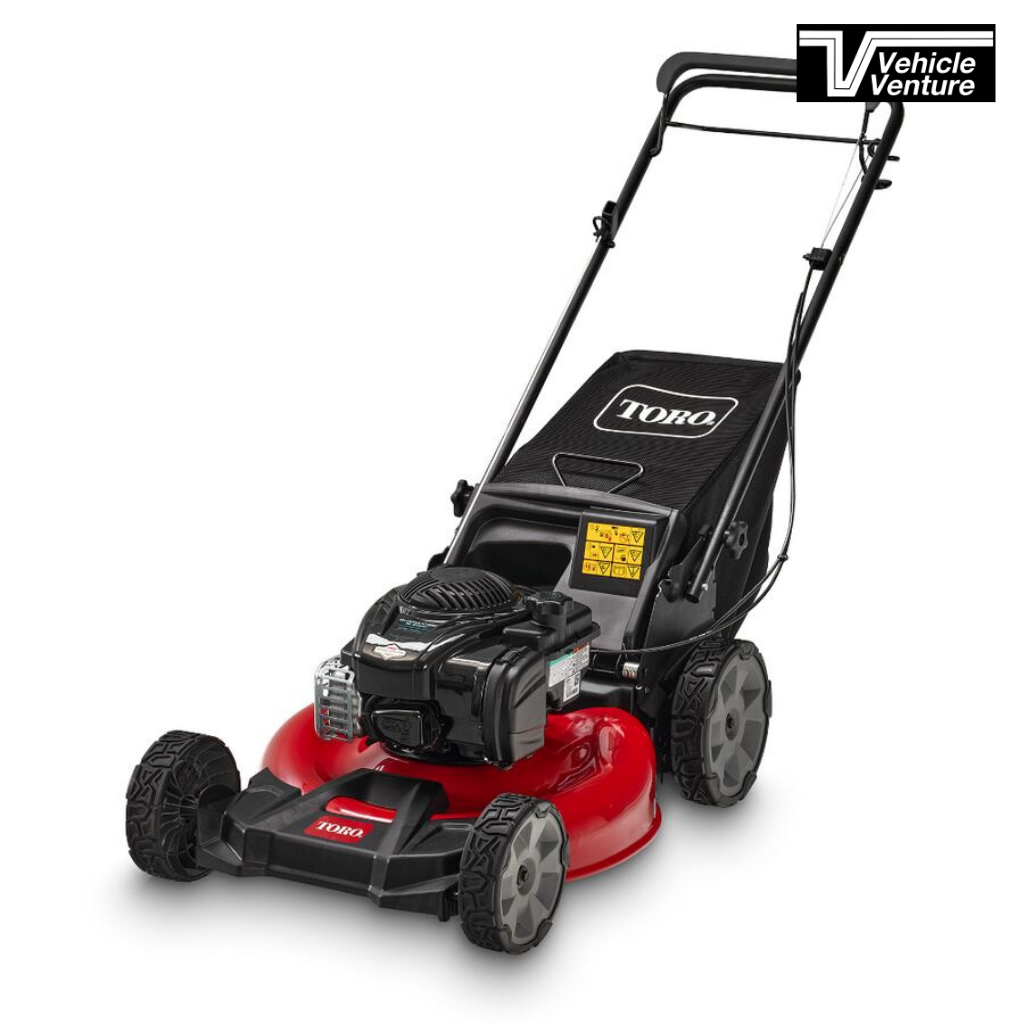 A TORO 21" Recycler RWD B/S 140cc red and black push lawn mower with a grass collection bag and large rear wheels, displayed on a white background.