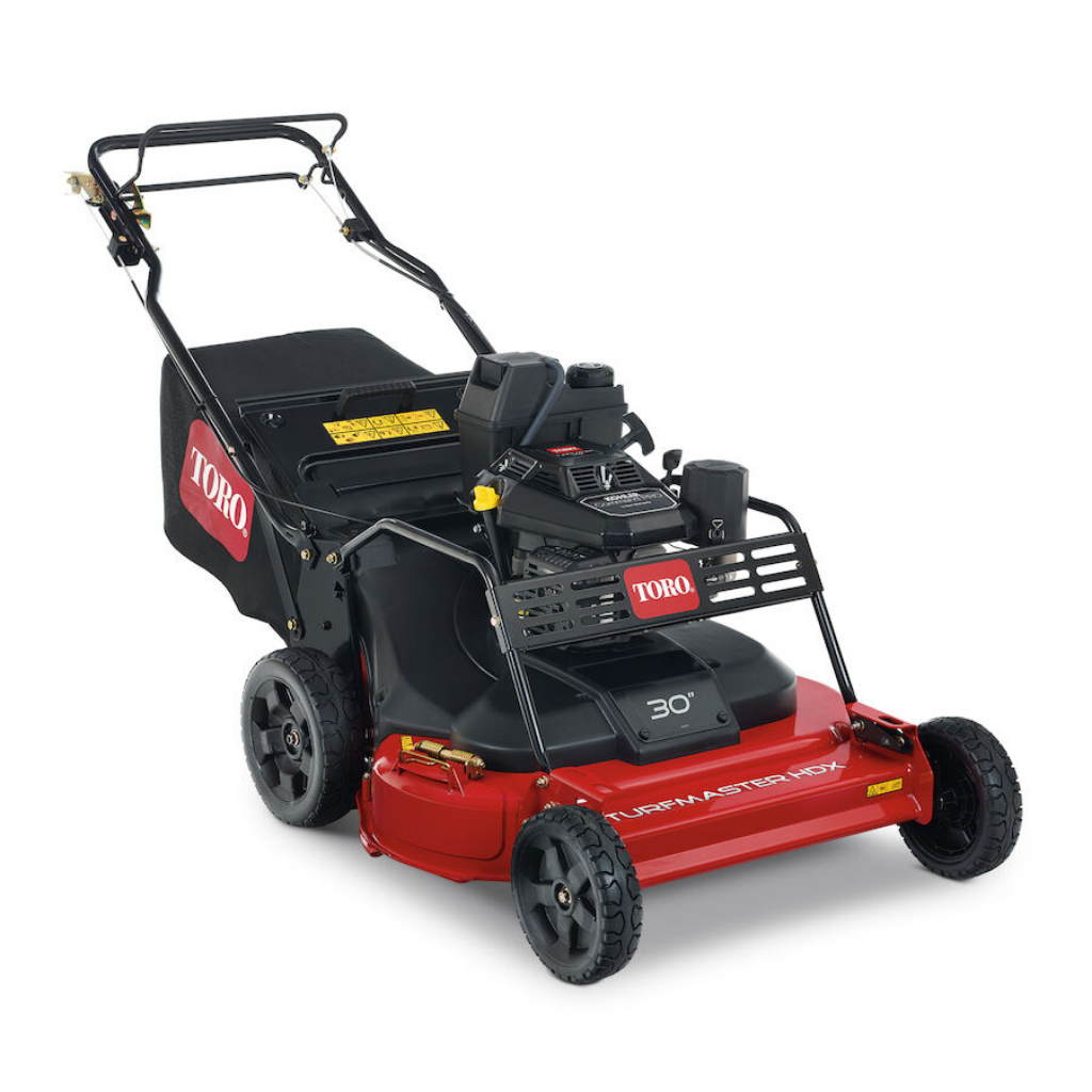 The TORO TURFMASTER 30"HDX 224CC KOHLER is a red and black lawn mower with a grass collection bag, handlebar controls, and sturdy wheels, ideal for residential or commercial lawn maintenance.